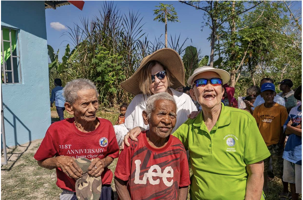Two elders with mission team members