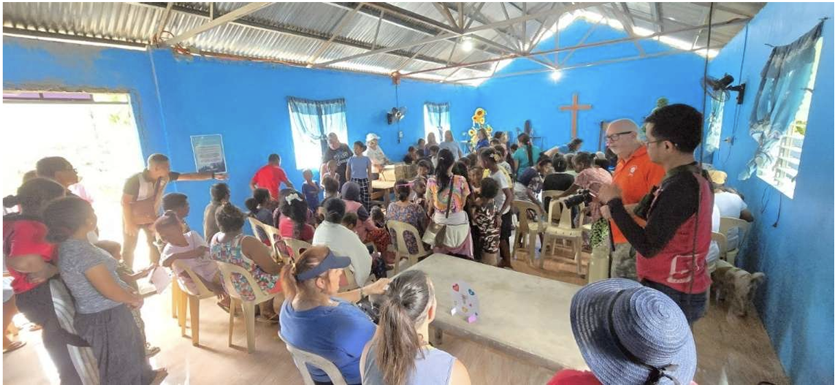 Community gathering inside Jean Chapel