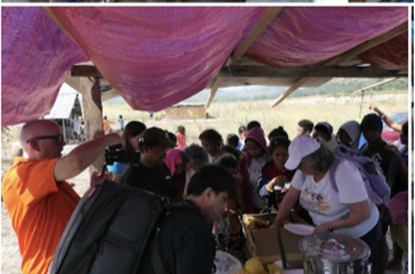 Community gathering during the mission visit